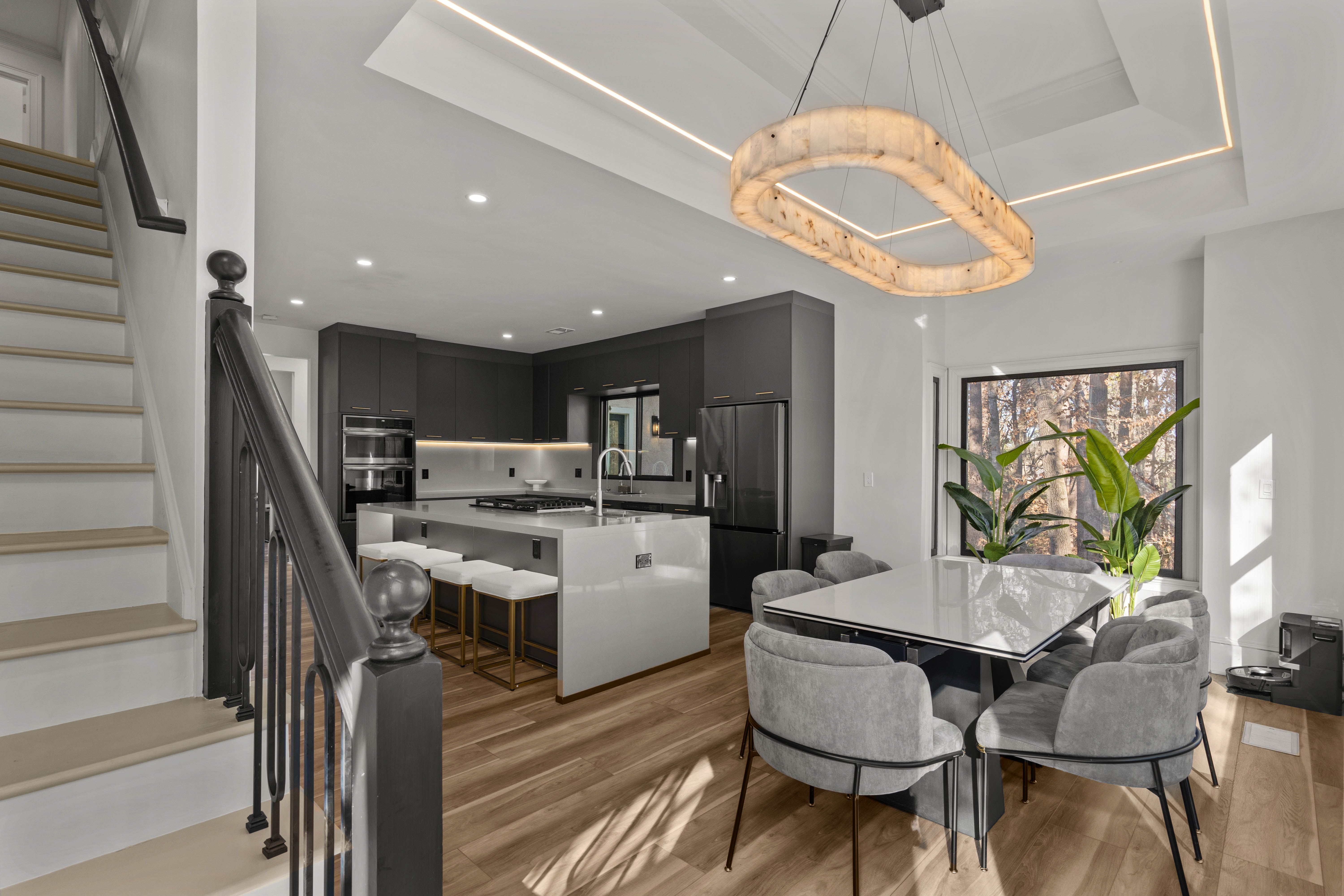 Kitchen after — modern dark cabinetry